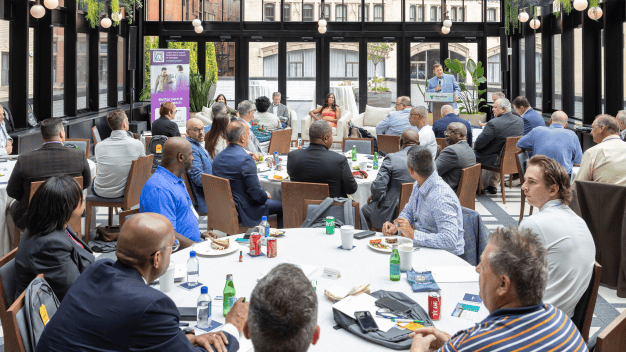 Attendees listening to a panel discussion at Marathon Health's Michigan Roundtable event in Detroit.