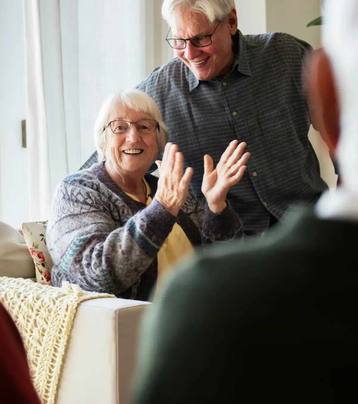 Older couple speaking with a financial planner.