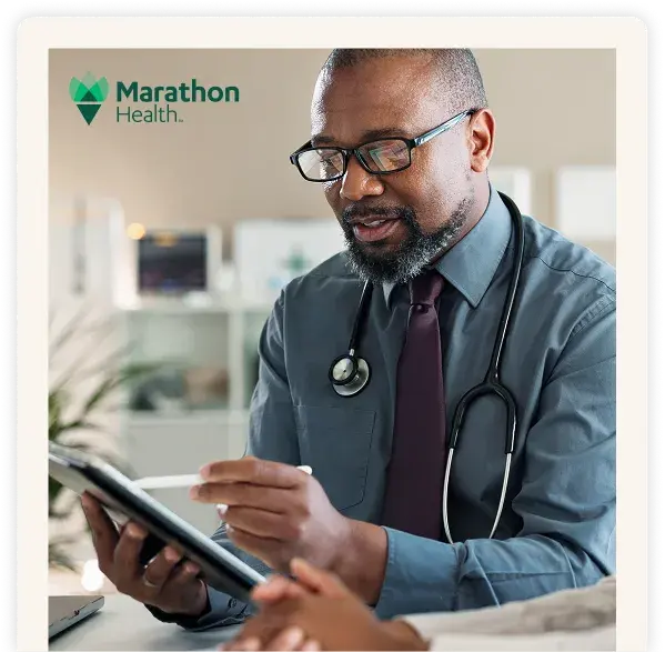 Healthcare provider analyzing claims spend on a tablet device.
