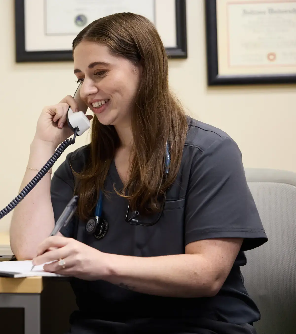 Marathon Health employee speaking on the phone.