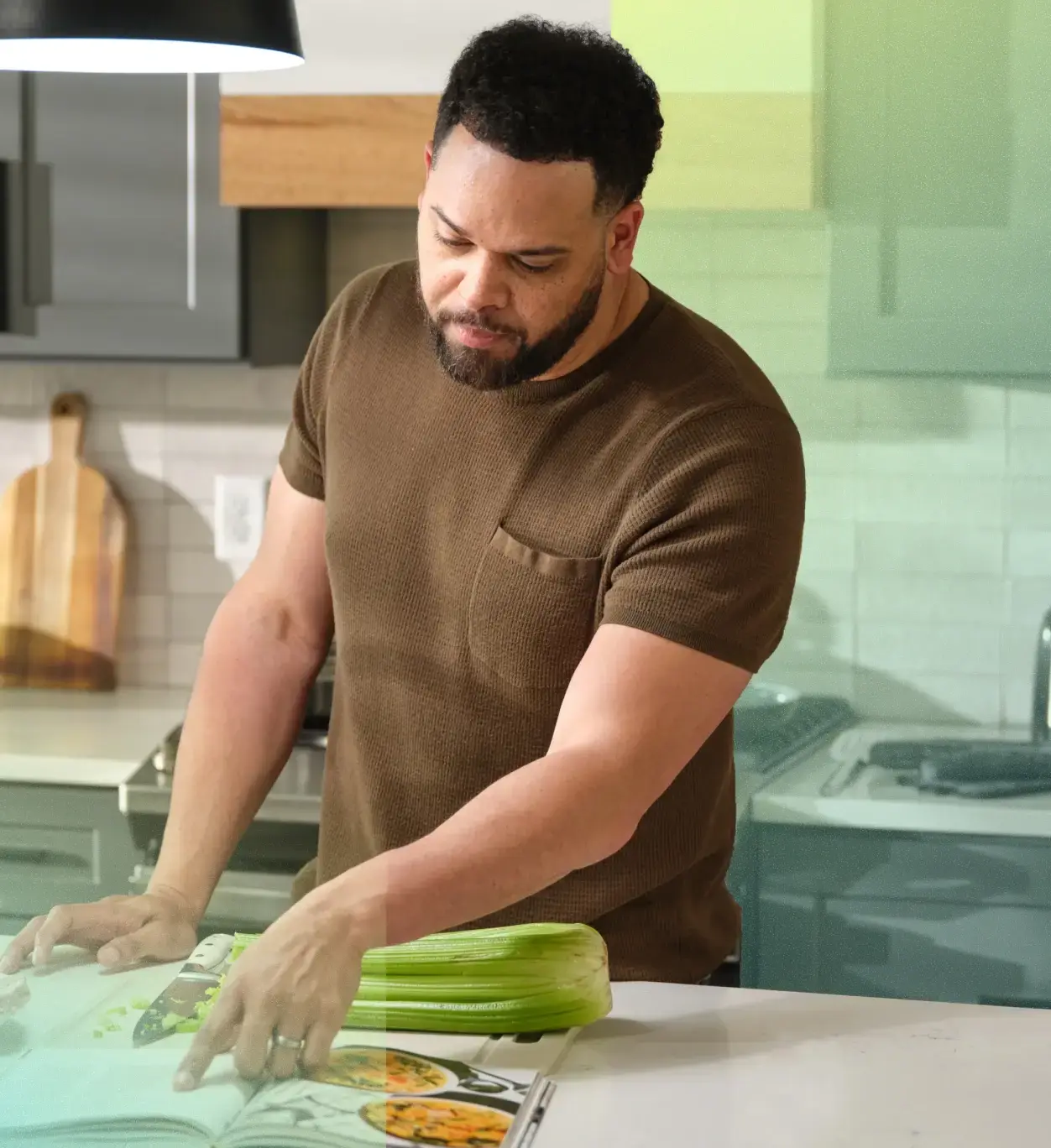 Man looking up a cooking recipe.