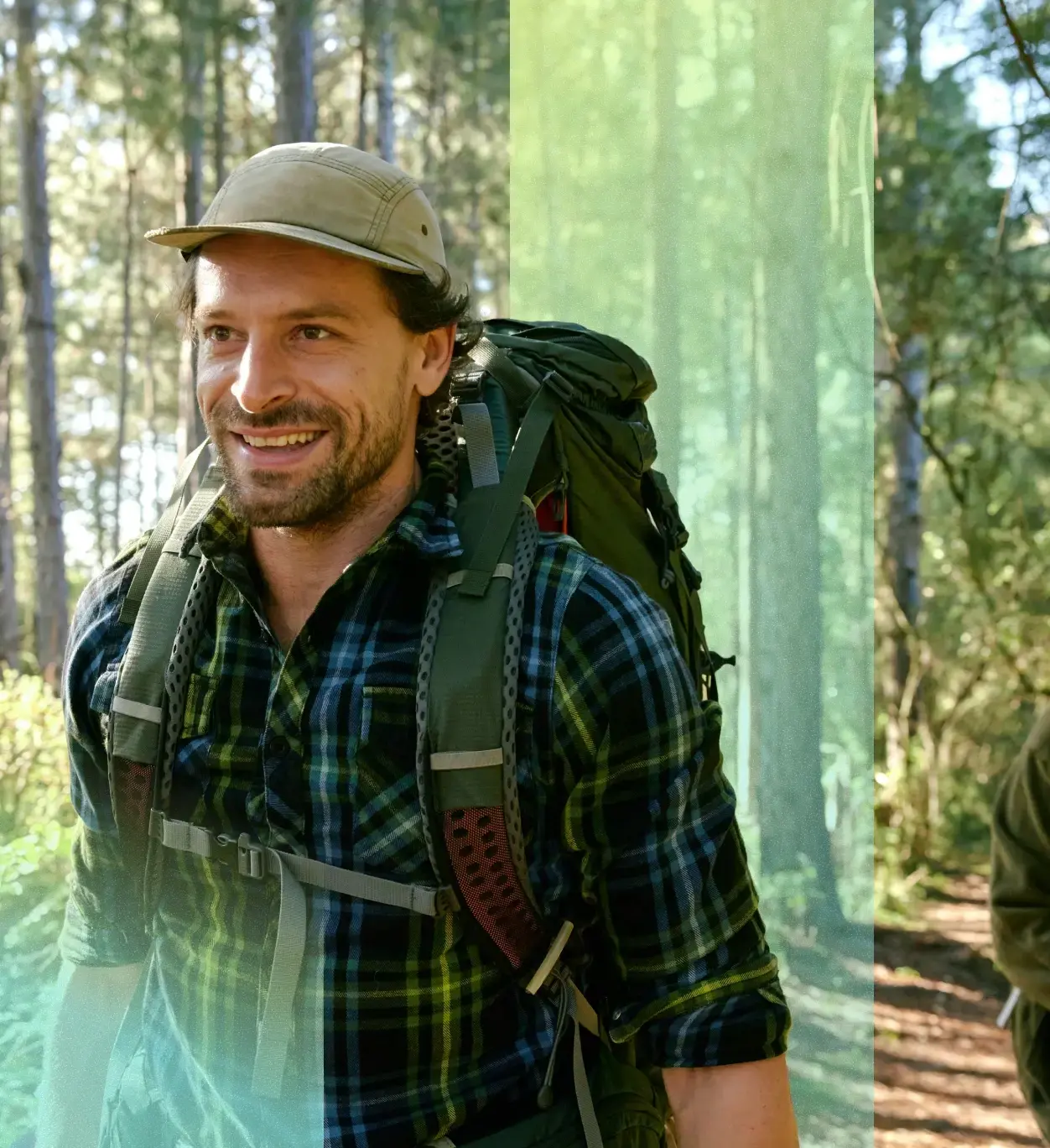Smiling hiker walking through a forest.