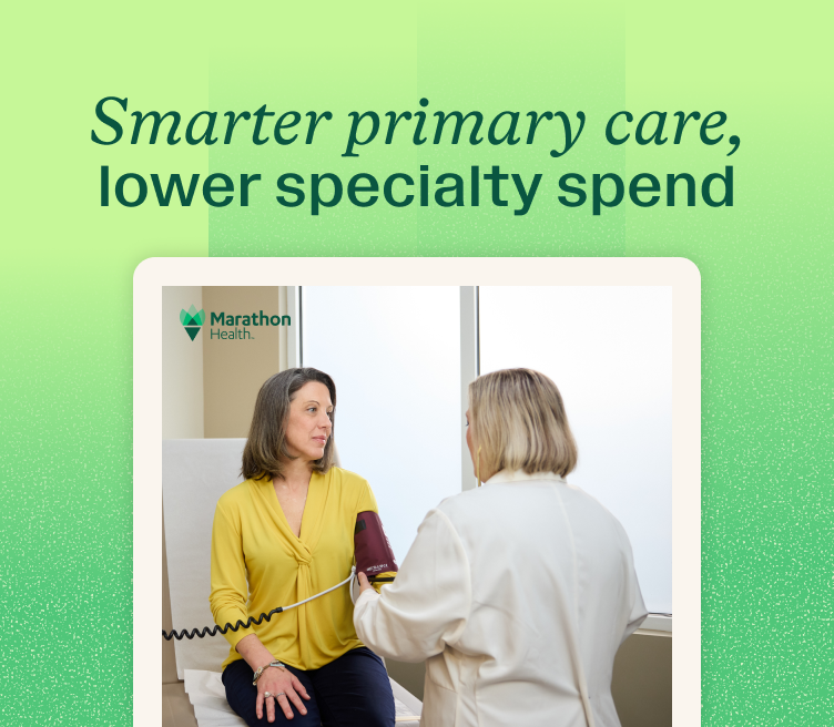 Smarter primary care, lower specialty spend: Marathon Health provider supports care coordination and care navigation through a patient blood pressure check in an exam room