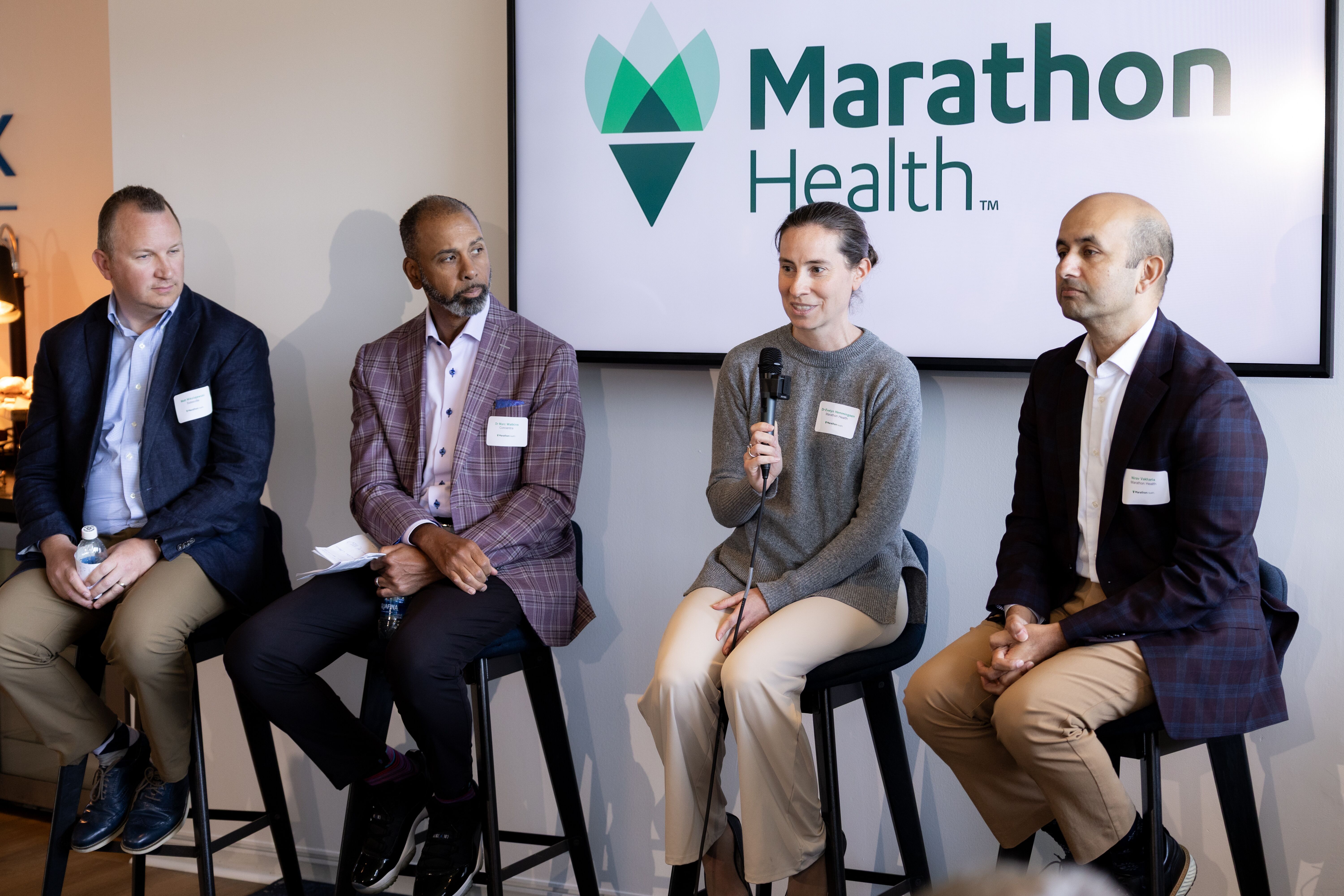 Matt Mikolajewski, Marc Watkins, Evelyn Hemmingsen, and Nirav Vakharia seated in front of a Marathon Health screen at the Ohio roundtable.
