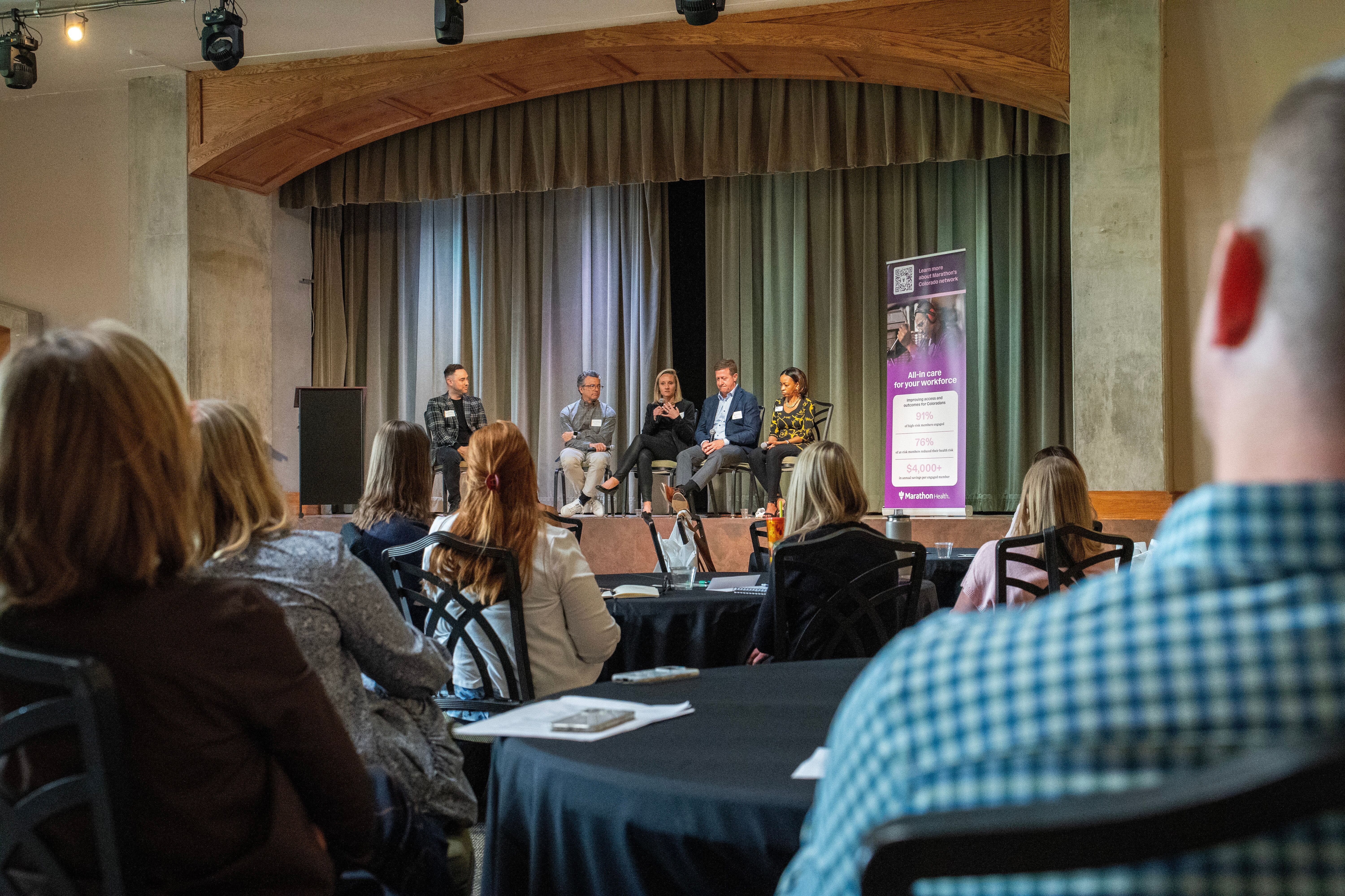 On stage at the Marathon Health Colorado roundtable: Keith Dennis, Vincent Atchity, Krista Beckwith, Todd Lambert, and Aisha Rousseau discuss workforce mental health.