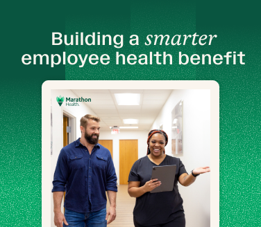 Building a smarter employee health benefit — guide to selecting and opening a health center, featuring Marathon Health staff in a hallway.