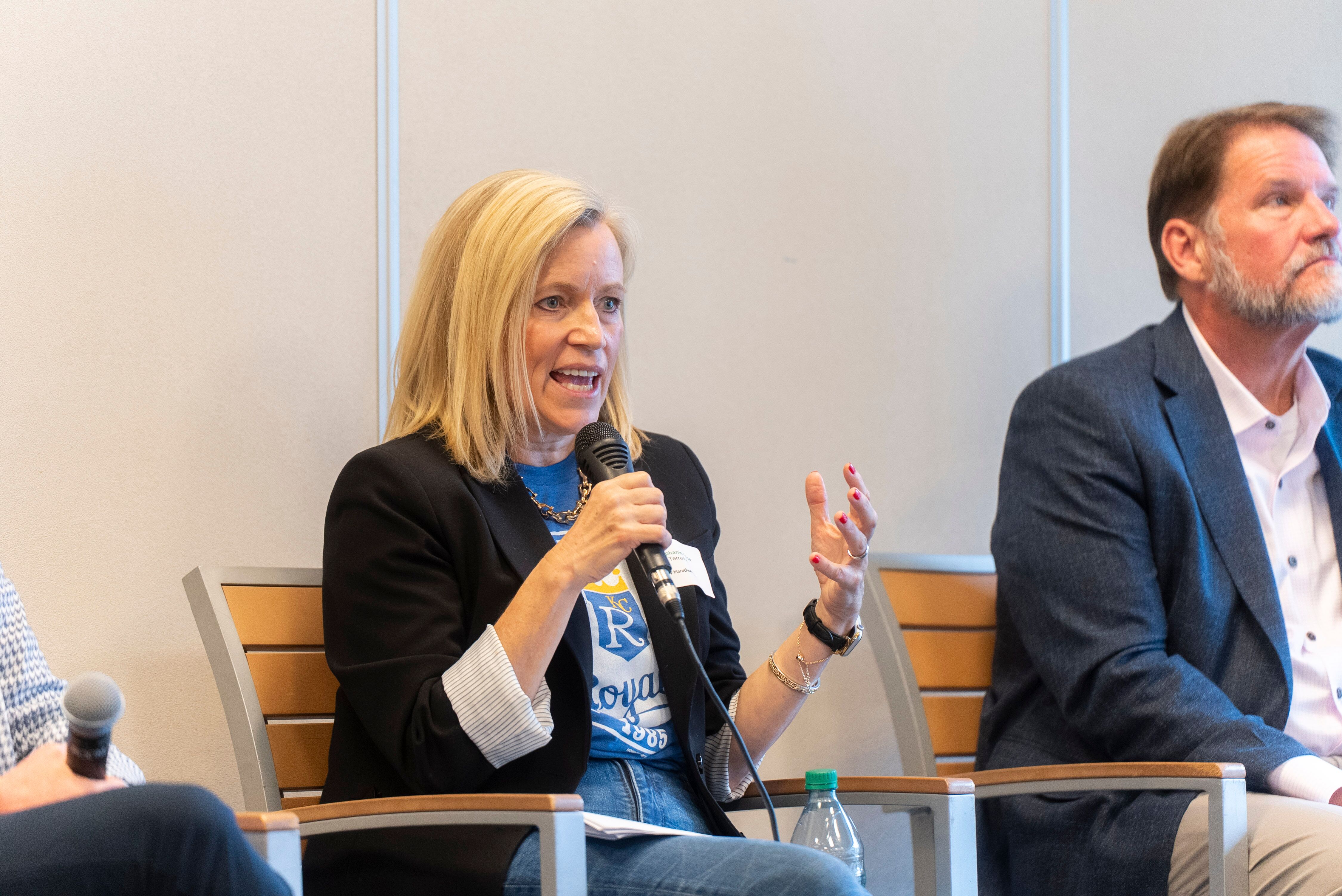 Stephanie Price in Kansas City Royals shirt speaking at Marathon Health roundtable.