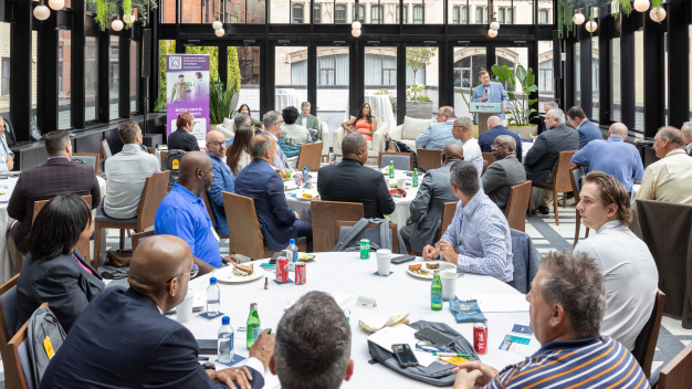 Attendees listening to a panel discussion at Marathon Health's Michigan Roundtable event in Detroit.
