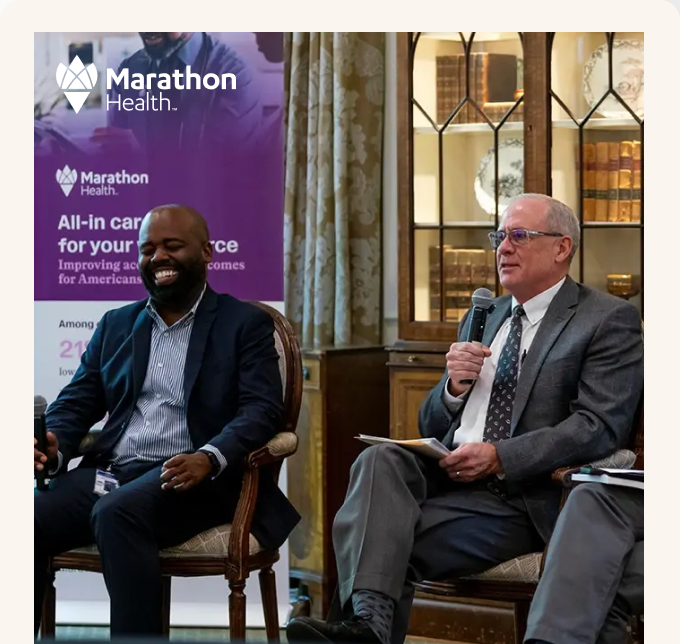 Dr. Raynard Washington and Chris Paterson at the Marathon Health Charlotte roundtable.